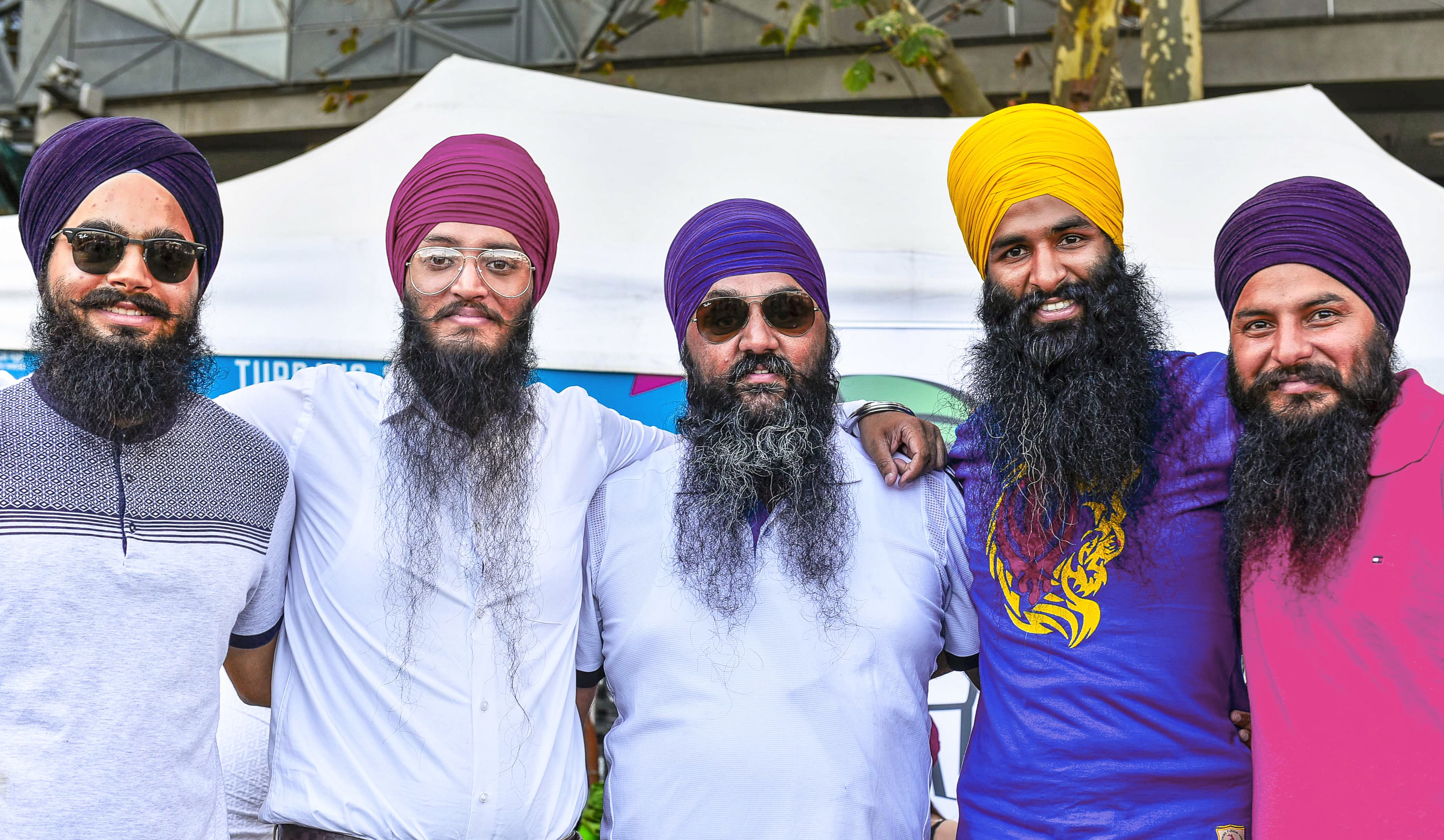 Five men wearing turbans at cultural festival